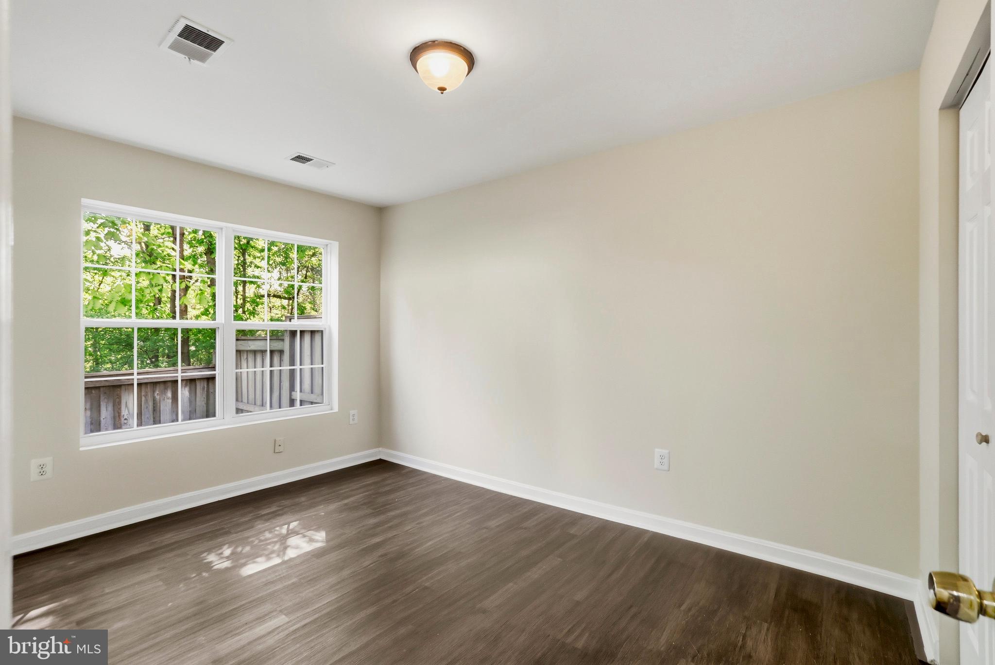 21648 Frame Square Broadlands, VA 20148 - Photo 31 of 36 an empty room with wooden floor and windows