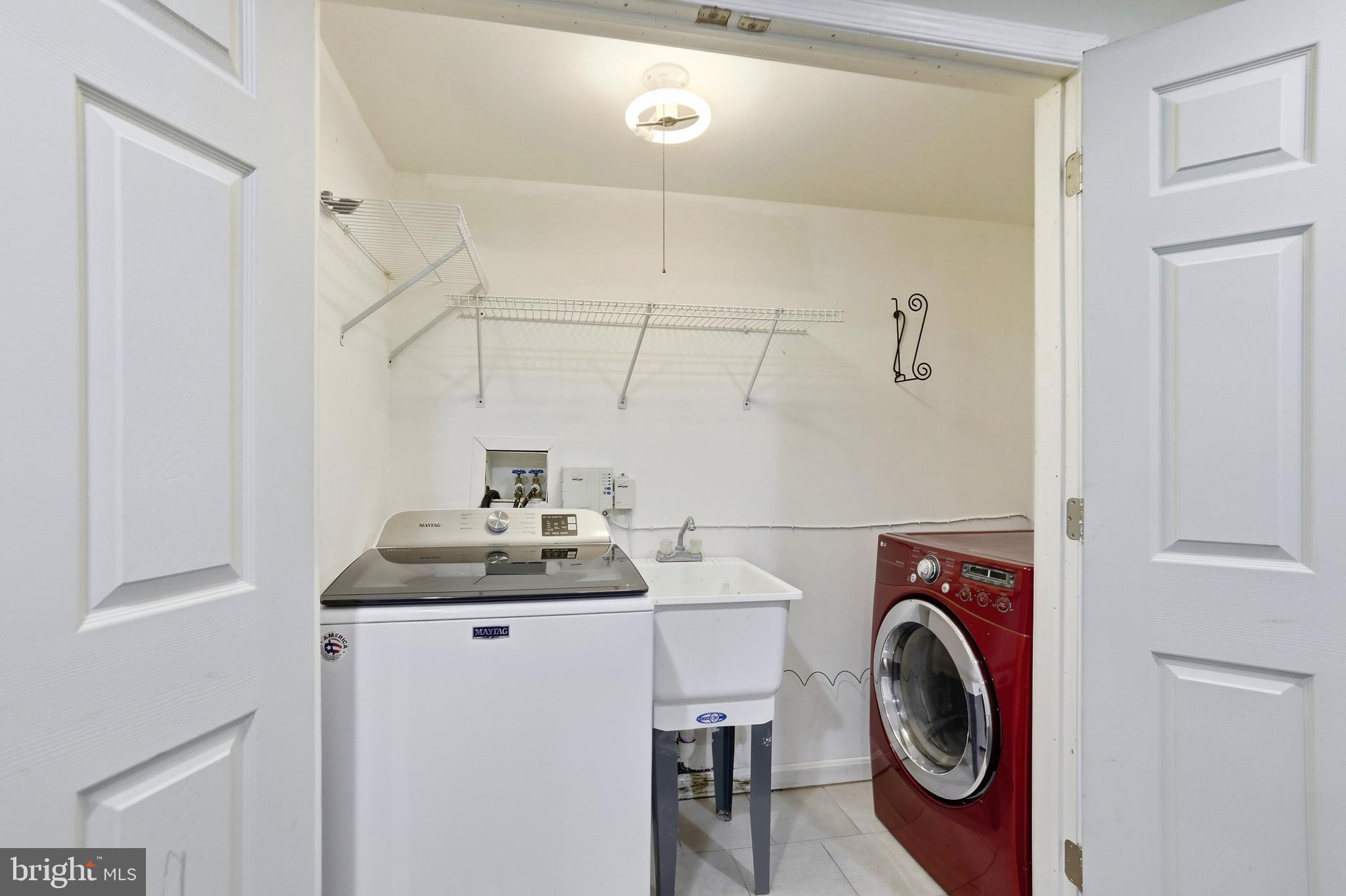 21648 Frame Square Broadlands, VA 20148 - Photo 32 of 36 a utility room with dryer and washer