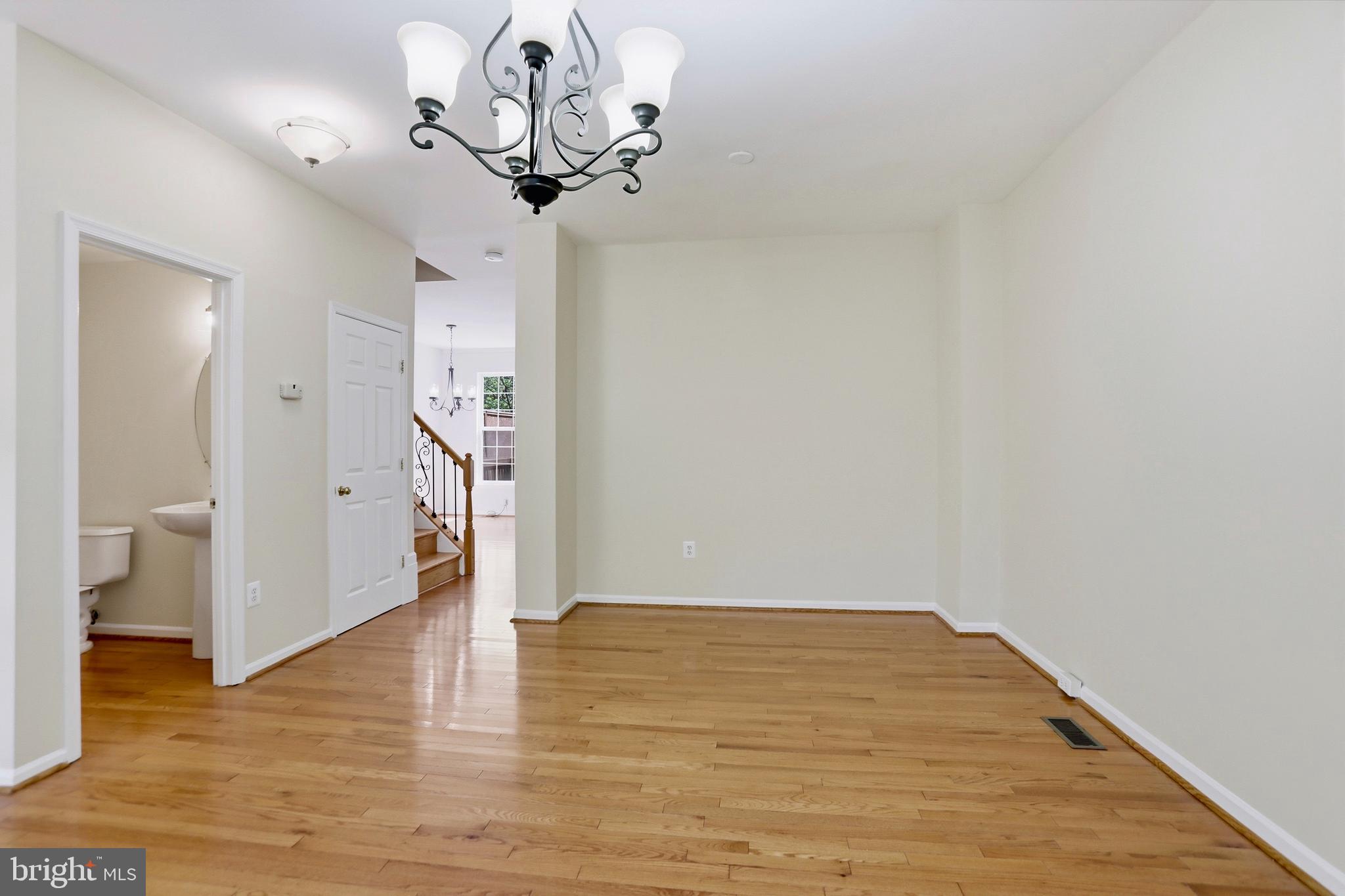 21648 Frame Square Broadlands, VA 20148 - Photo 8 of 36 a view of a hallway with wooden floor