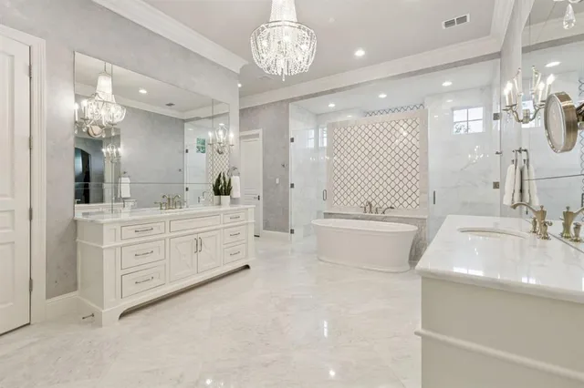 a bathroom with a double vanity sink a toilet a mirror and shower