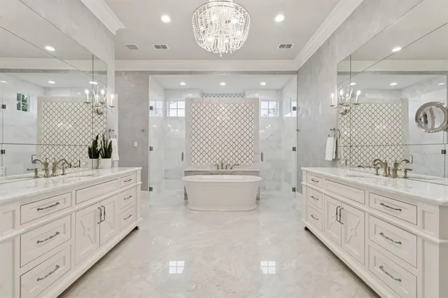 a spacious bathroom with a double vanity sink mirror double and bathtub