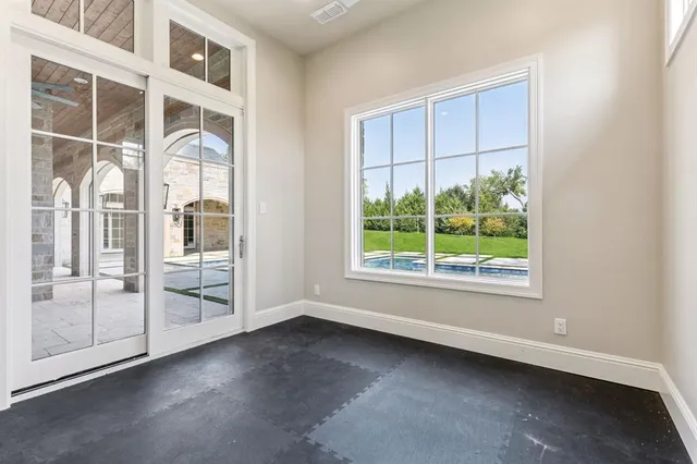 an empty room with windows