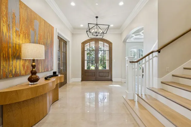 a view of a livingroom with furniture and a chandelier