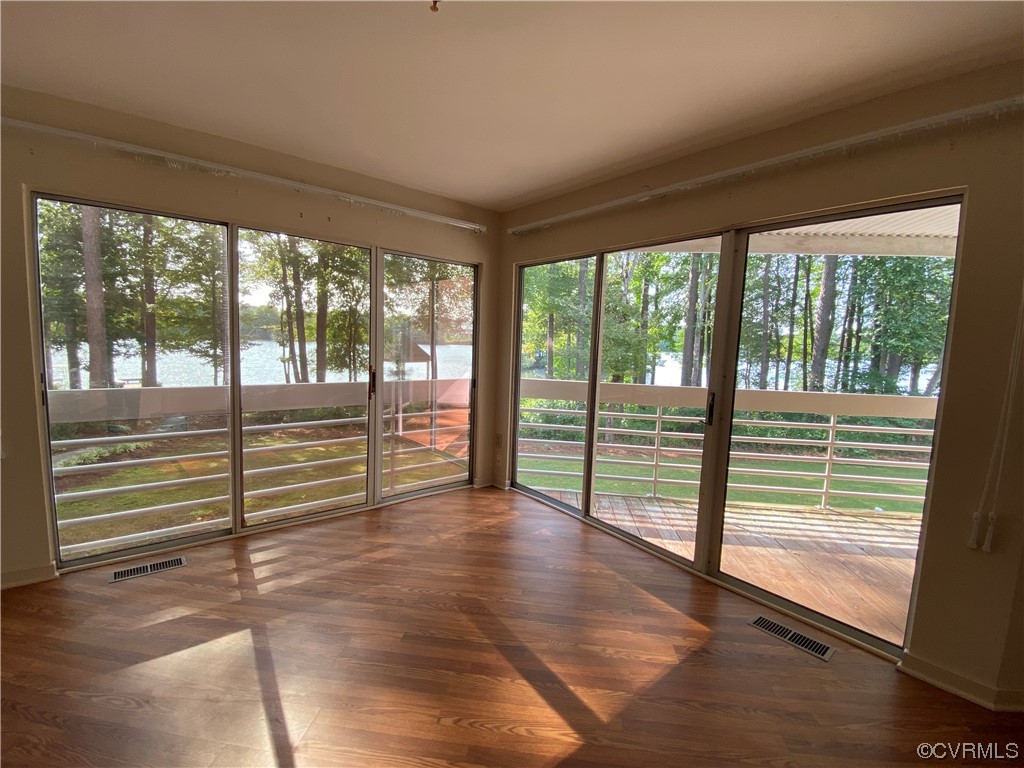 126 Water Pointe Court Midlothian, VA 23112 - Photo 1 of 19 a view of empty room with wooden floor and floor to ceiling window