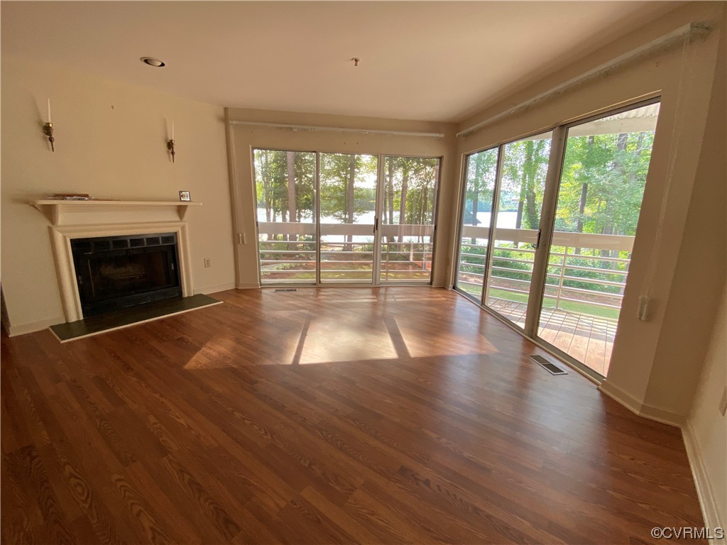 126 Water Pointe Court Midlothian, VA 23112 - Photo 10 of 19 a view of empty room with wooden floor and fireplace