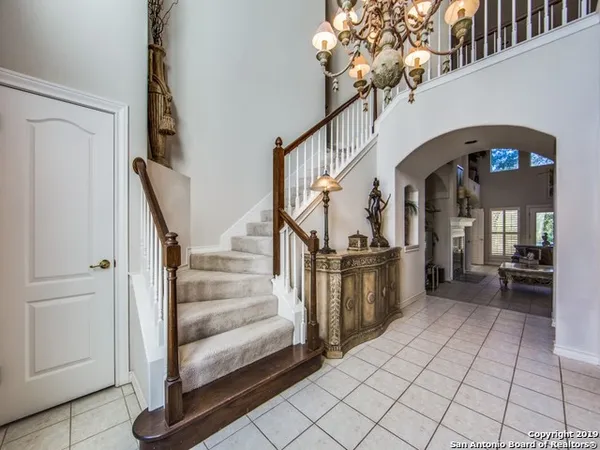 a view of entryway and hall with a front door
