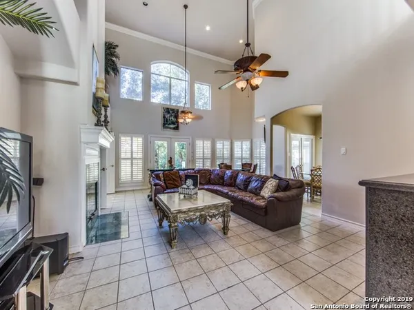 a living room with fireplace furniture and a flat screen tv