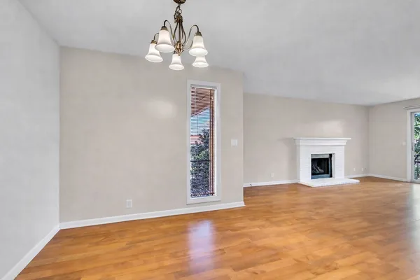 a view of livingroom with hardwood floor and a ceiling fan