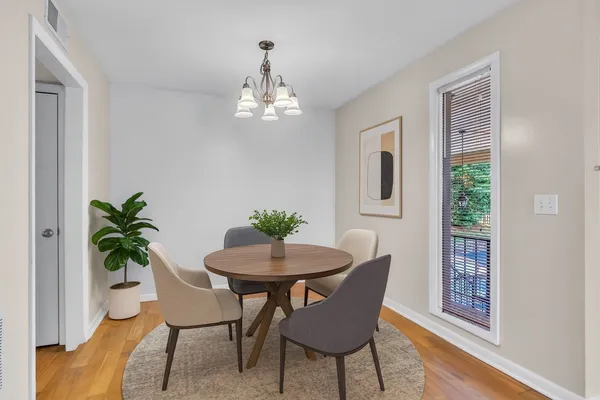 a kitchen with stainless steel appliances granite countertop a sink and dishwasher a granite countertops with wooden floor