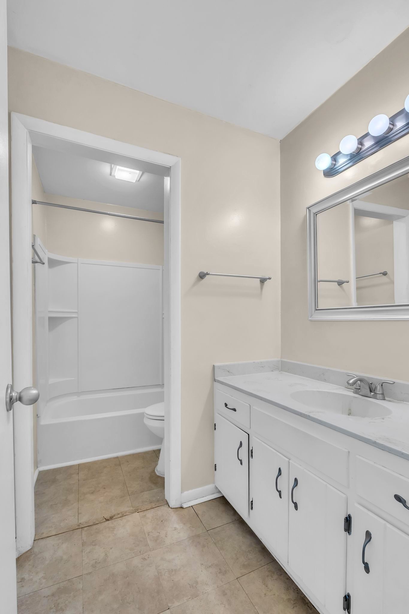 2116 Hobbs Road, Unit N19 Nashville, TN 37215 - Photo 20 of 33 a bathroom with a granite countertop sink a mirror and a bathtub