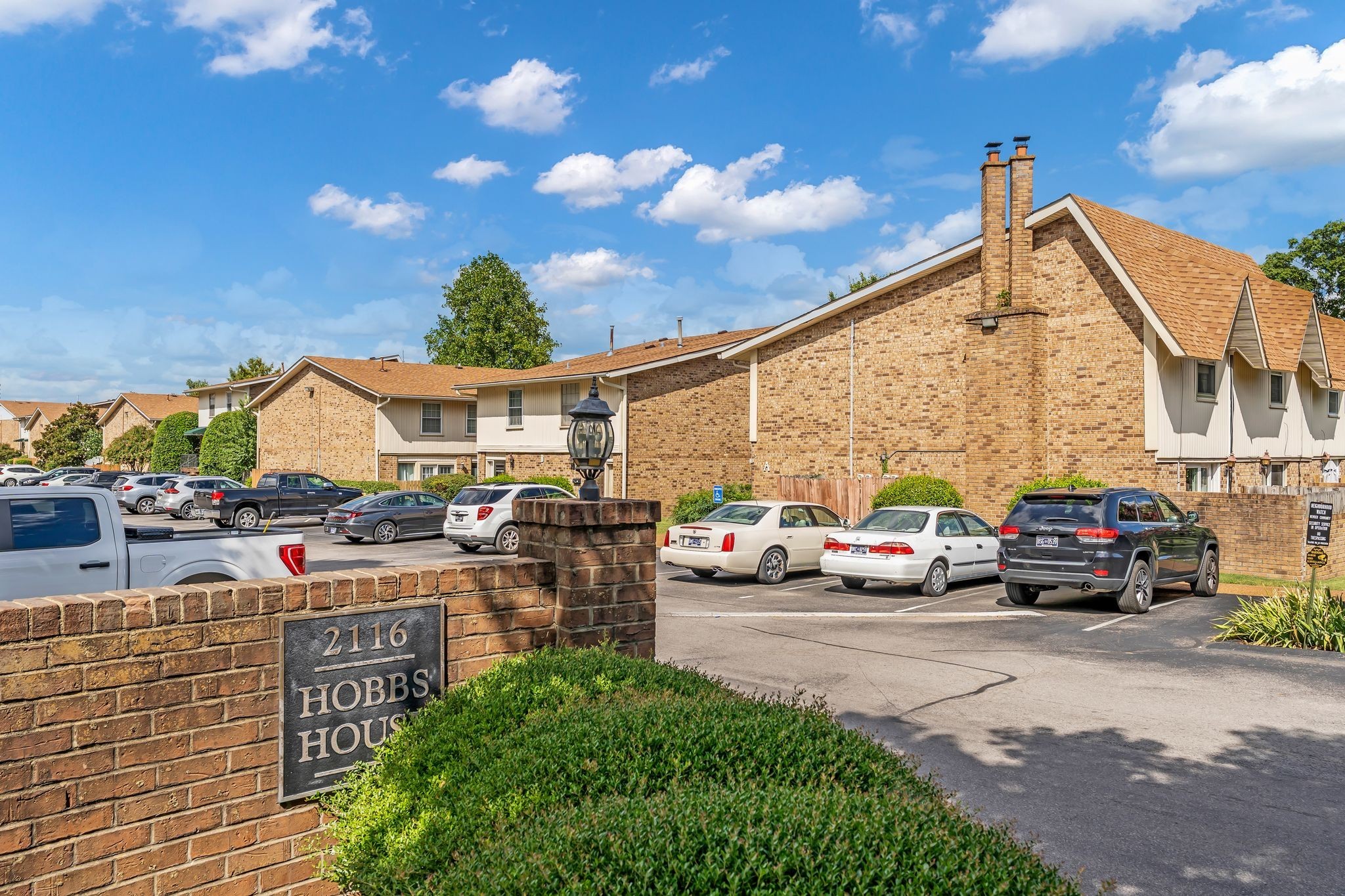2116 Hobbs Road, Unit N19 Nashville, TN 37215 - Photo 2 of 33 a view of multiple houses with yard