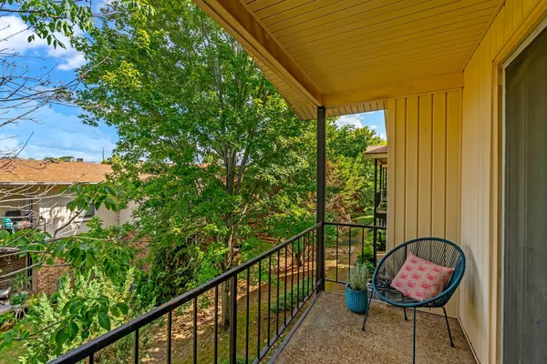 a view of balcony with yard