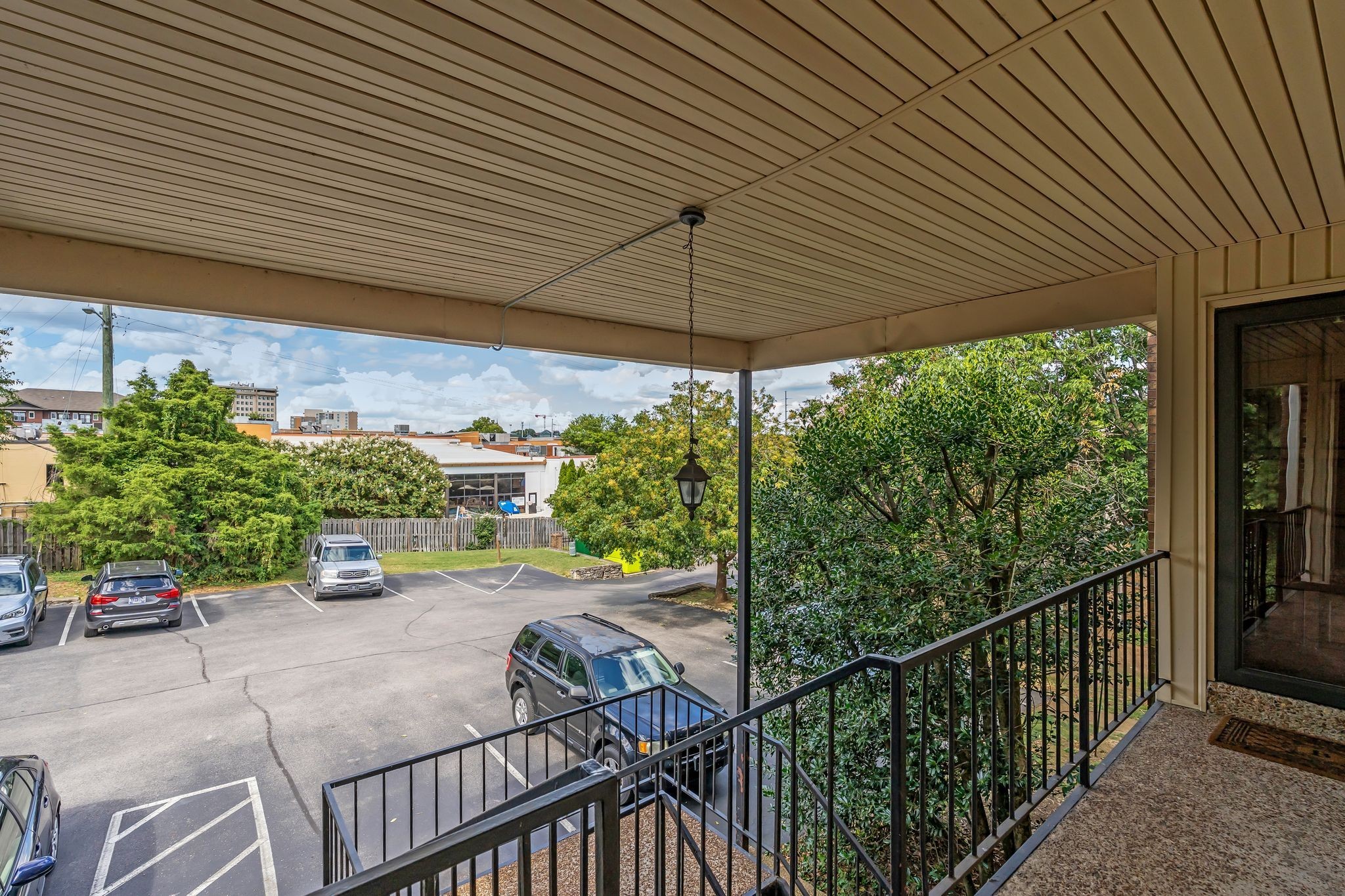 2116 Hobbs Road, Unit N19 Nashville, TN 37215 - Photo 5 of 33 a view of a patio with table and chairs under an umbrella