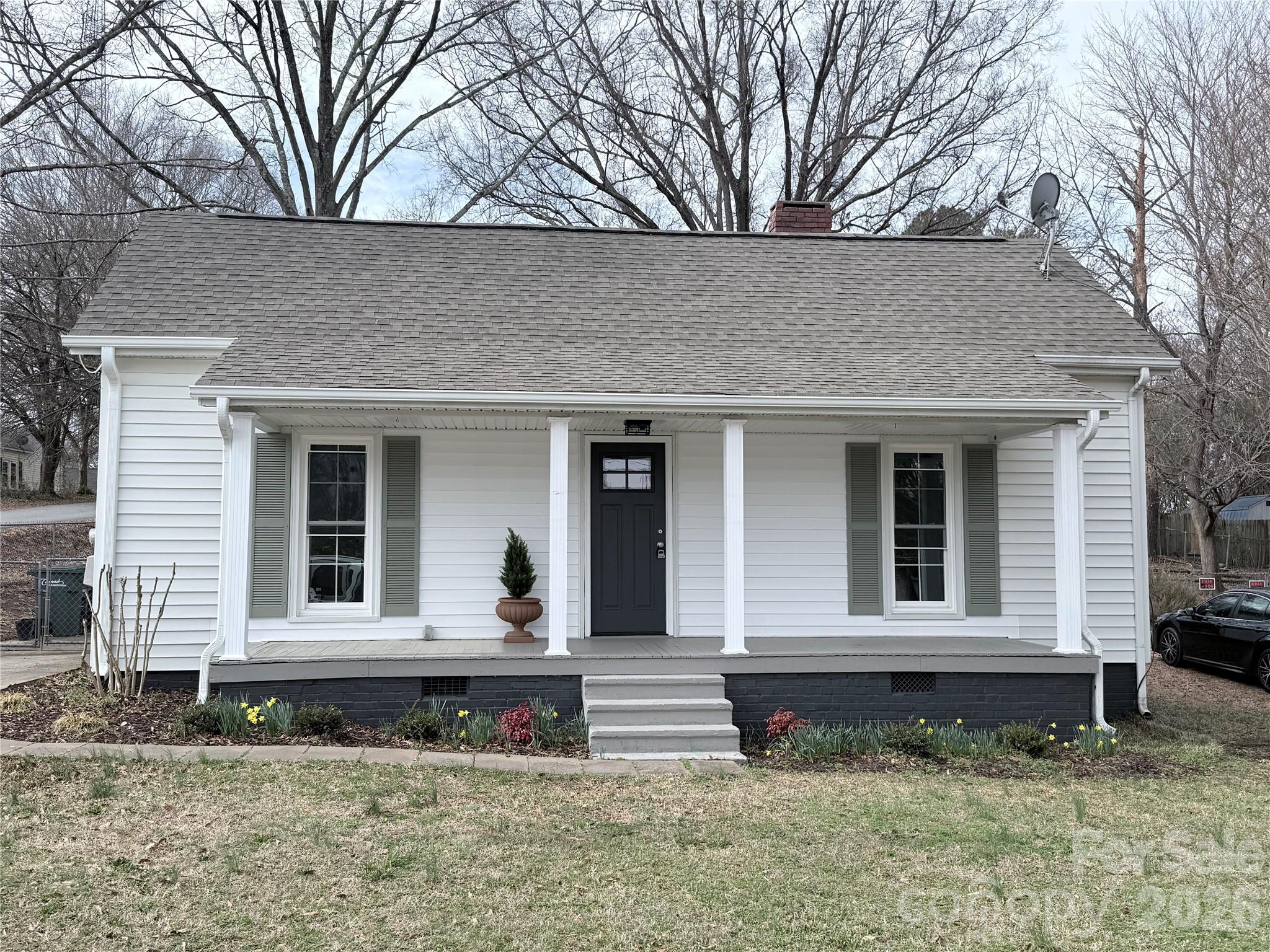 61 3rd Street Northwest Concord, NC 28027 - Photo 1 of 40 a front view of a house with garden