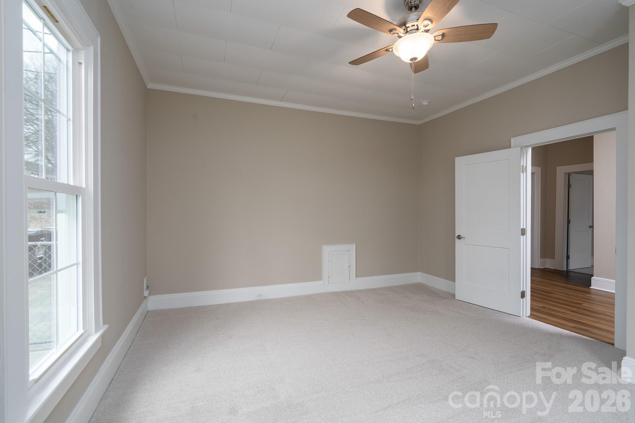 61 3rd Street Northwest Concord, NC 28027 - Photo 18 of 40 a view of an empty room with a window