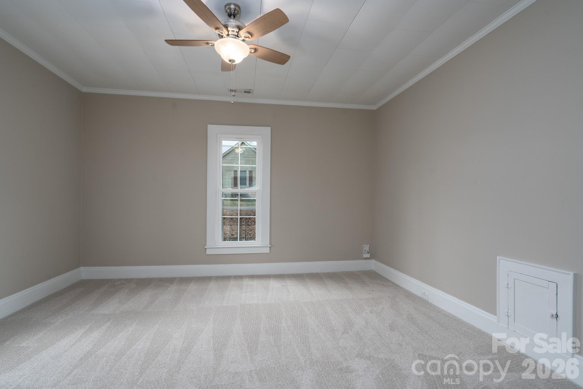61 3rd Street Northwest Concord, NC 28027 - Photo 19 of 40 wooden floor in an empty room with a window