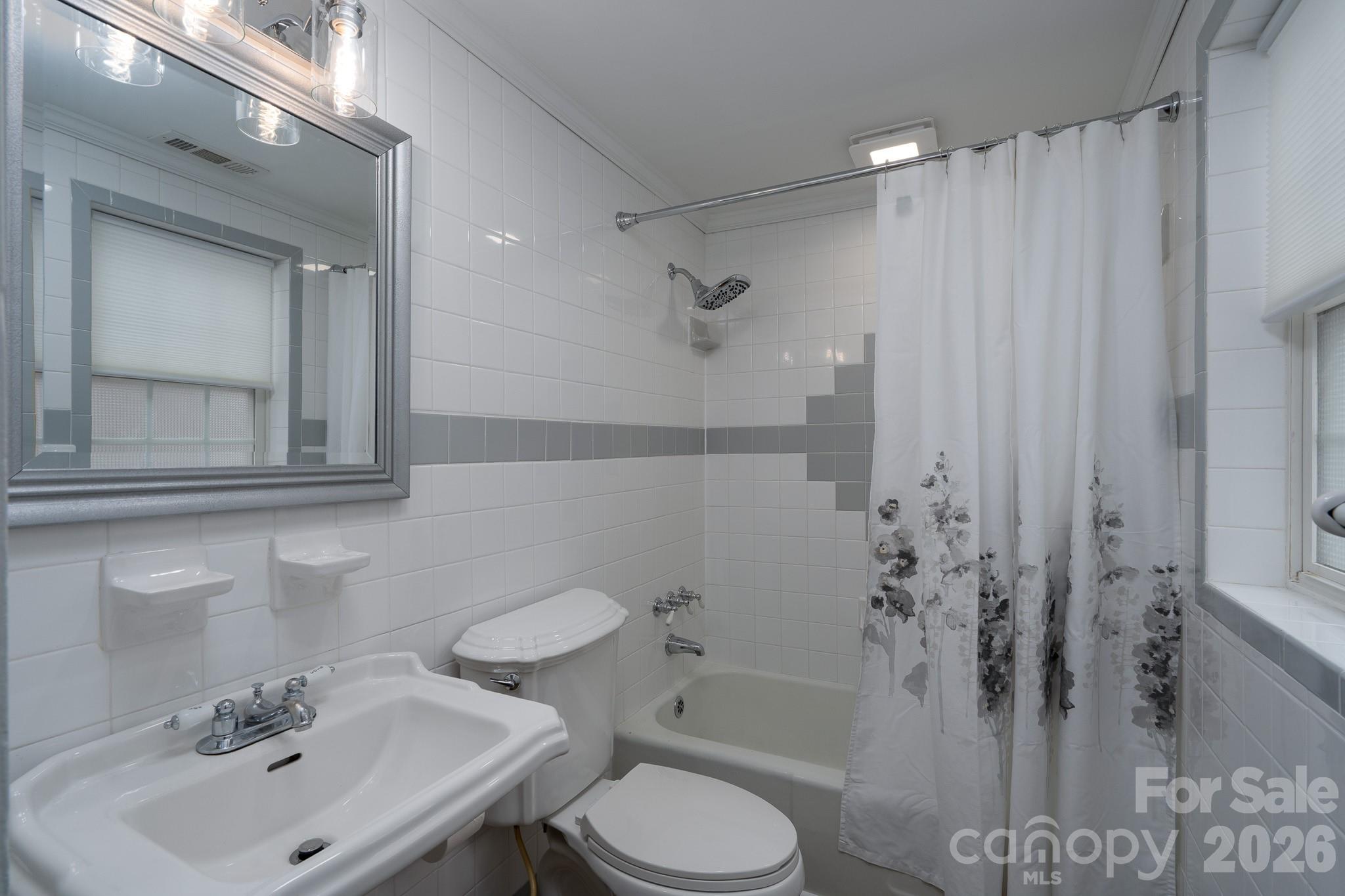 61 3rd Street Northwest Concord, NC 28027 - Photo 20 of 40 a bathroom with a sink toilet and shower