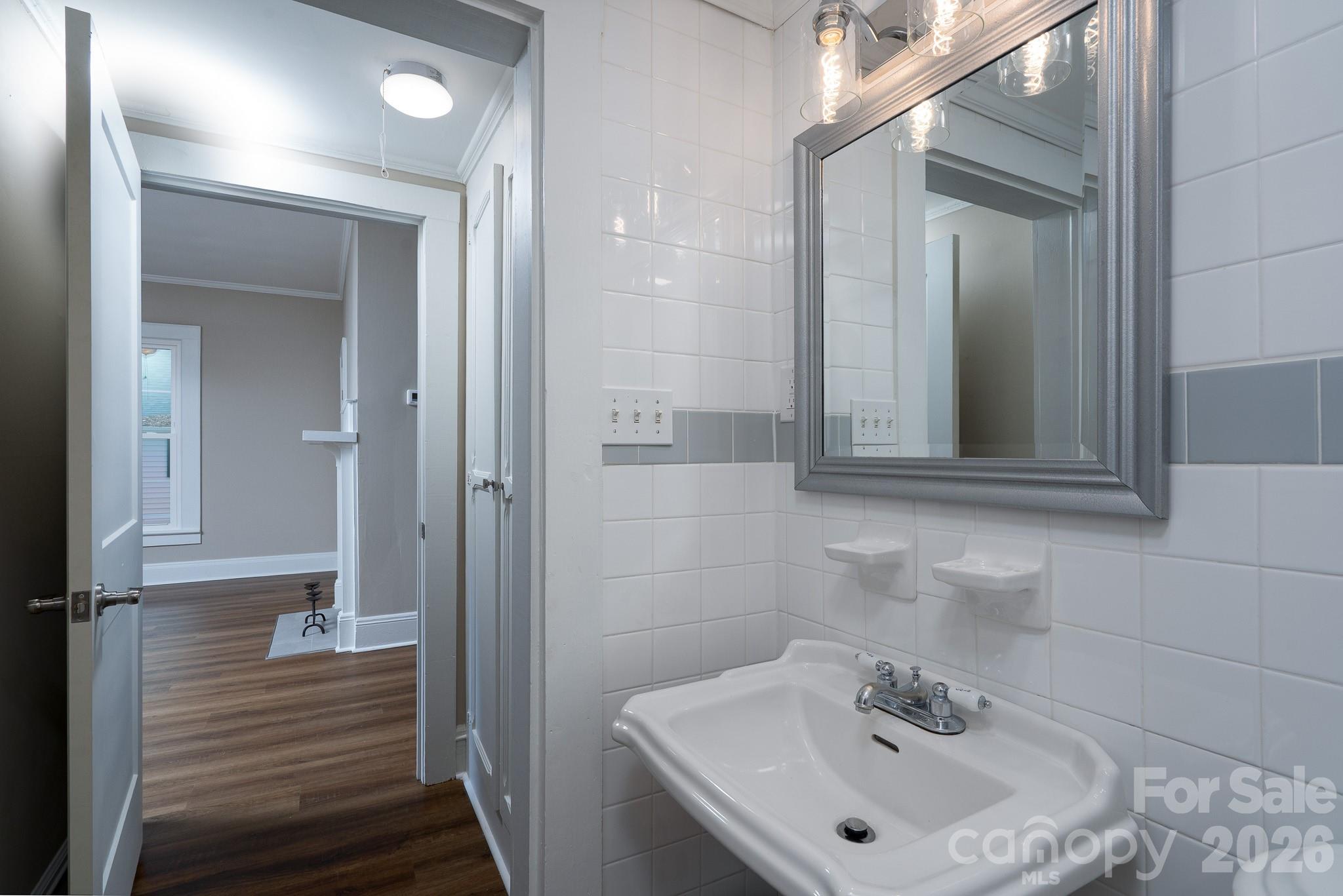 61 3rd Street Northwest Concord, NC 28027 - Photo 21 of 40 a bathroom with a sink and a mirror