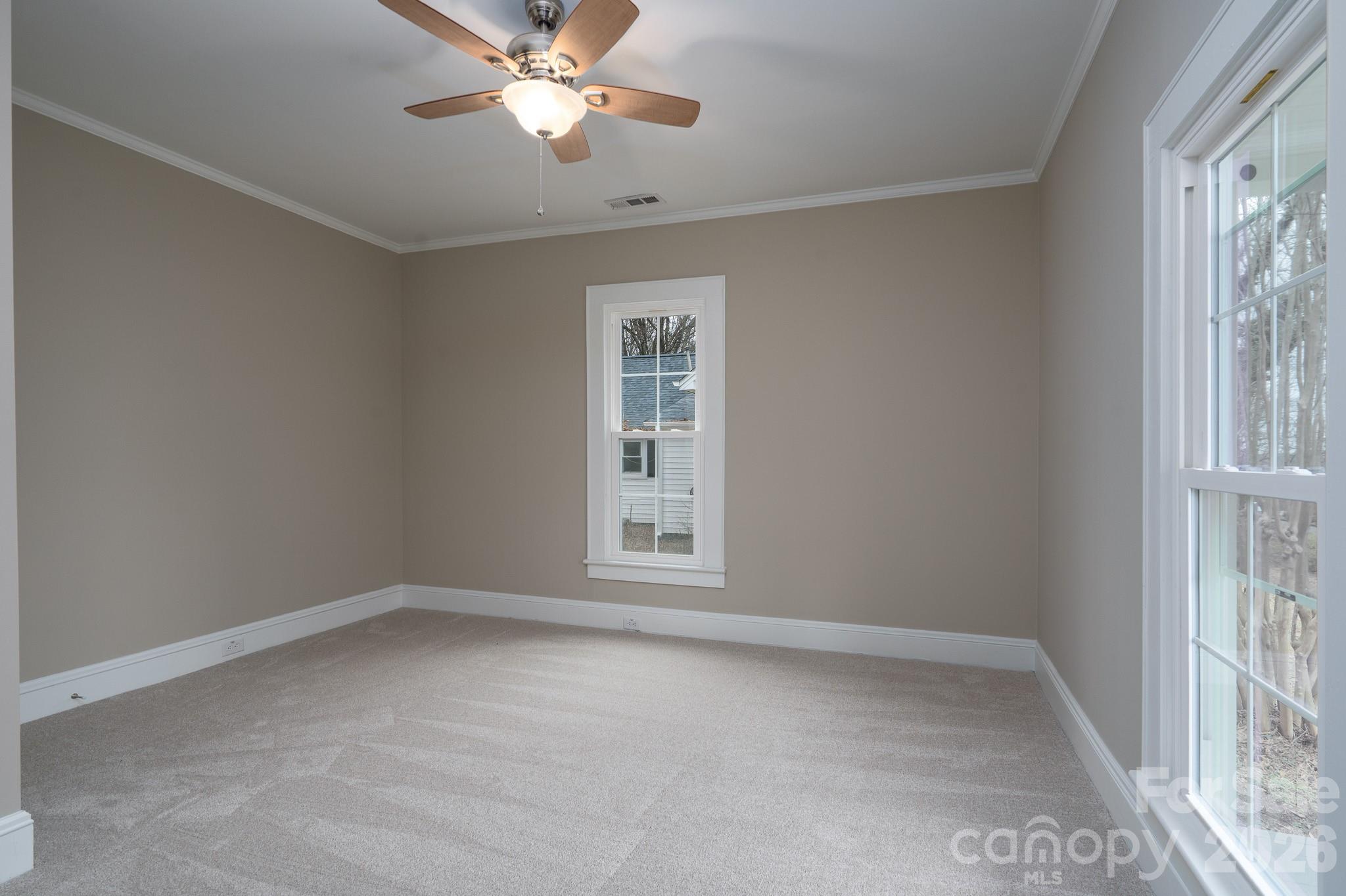 61 3rd Street Northwest Concord, NC 28027 - Photo 25 of 40 a view of an empty room with a window