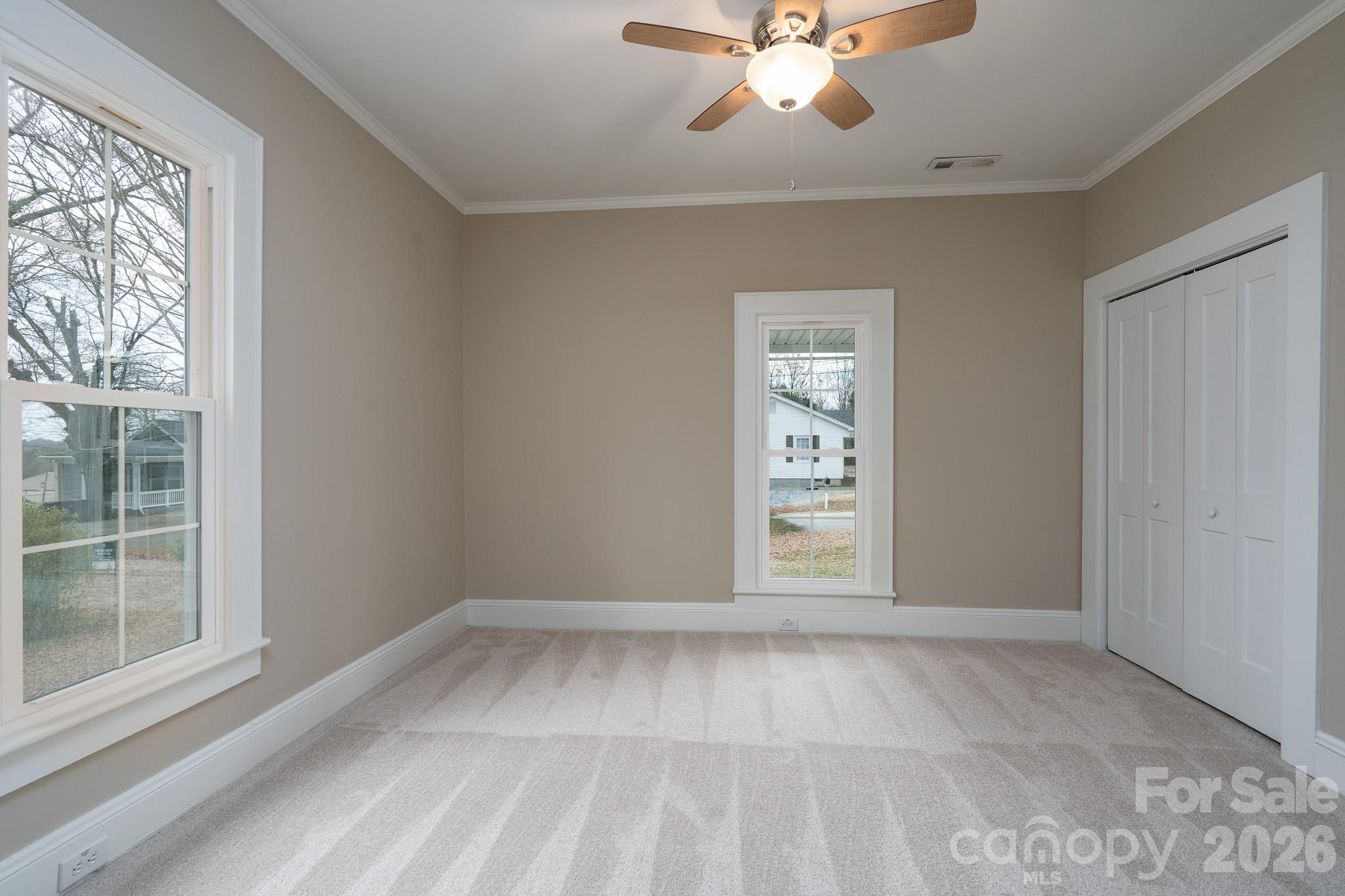 61 3rd Street Northwest Concord, NC 28027 - Photo 26 of 40 a view of an empty room with a window