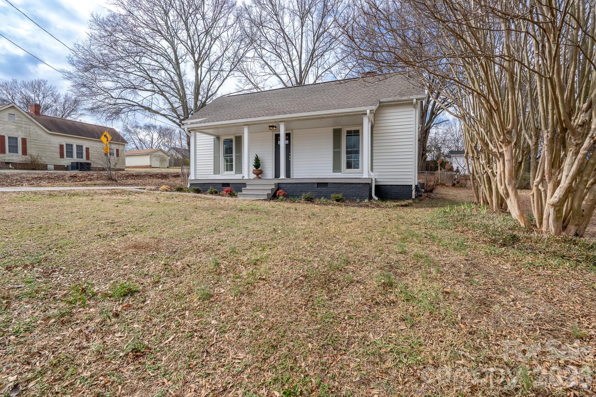61 3rd Street Northwest Concord, NC 28027 - Photo 30 of 40 a view of a house with a yard