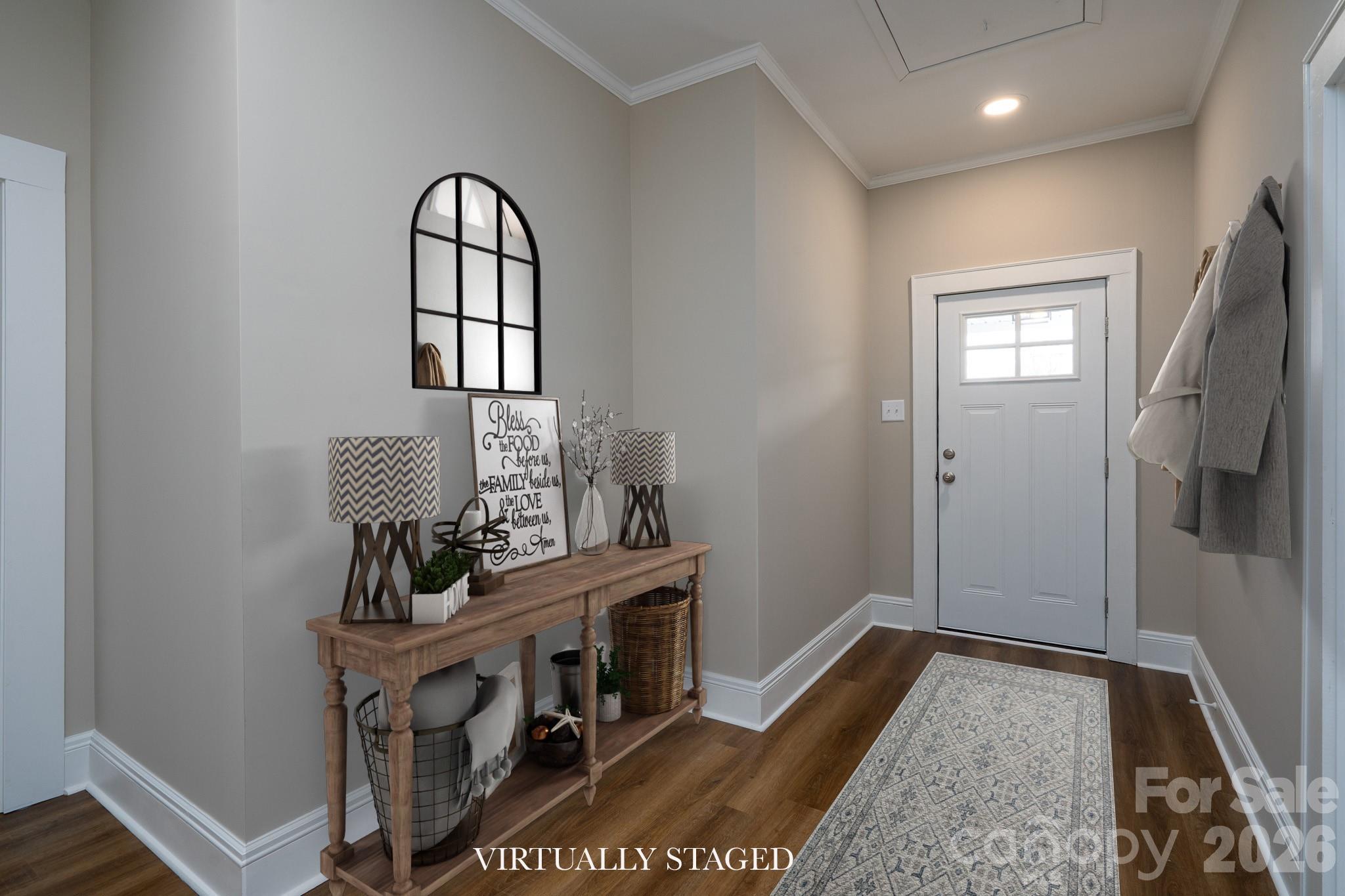 61 3rd Street Northwest Concord, NC 28027 - Photo 3 of 40 a view of an entryway with wooden floor