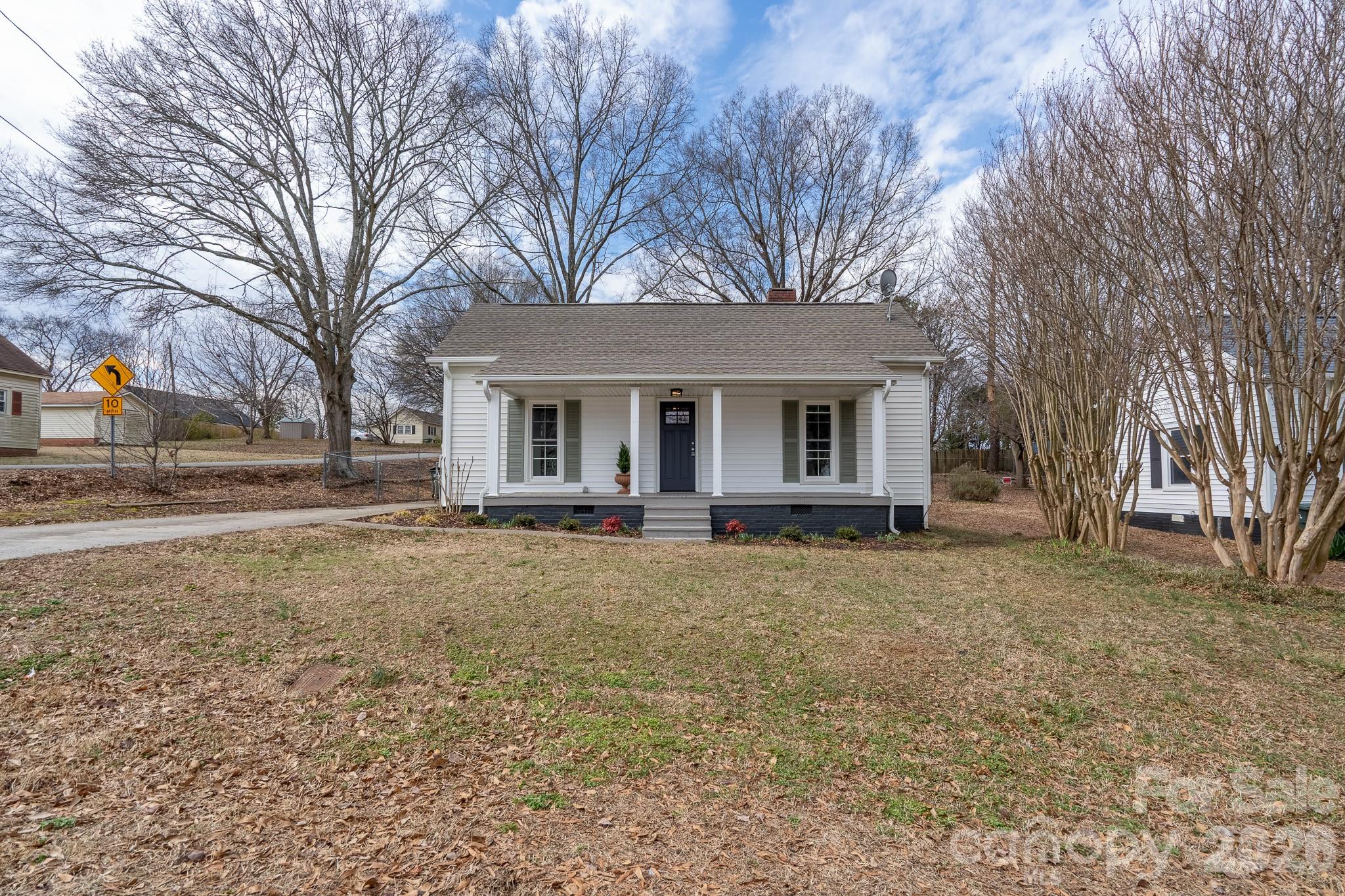 61 3rd Street Northwest Concord, NC 28027 - Photo 31 of 40 a view of a house with a yard covered in snow