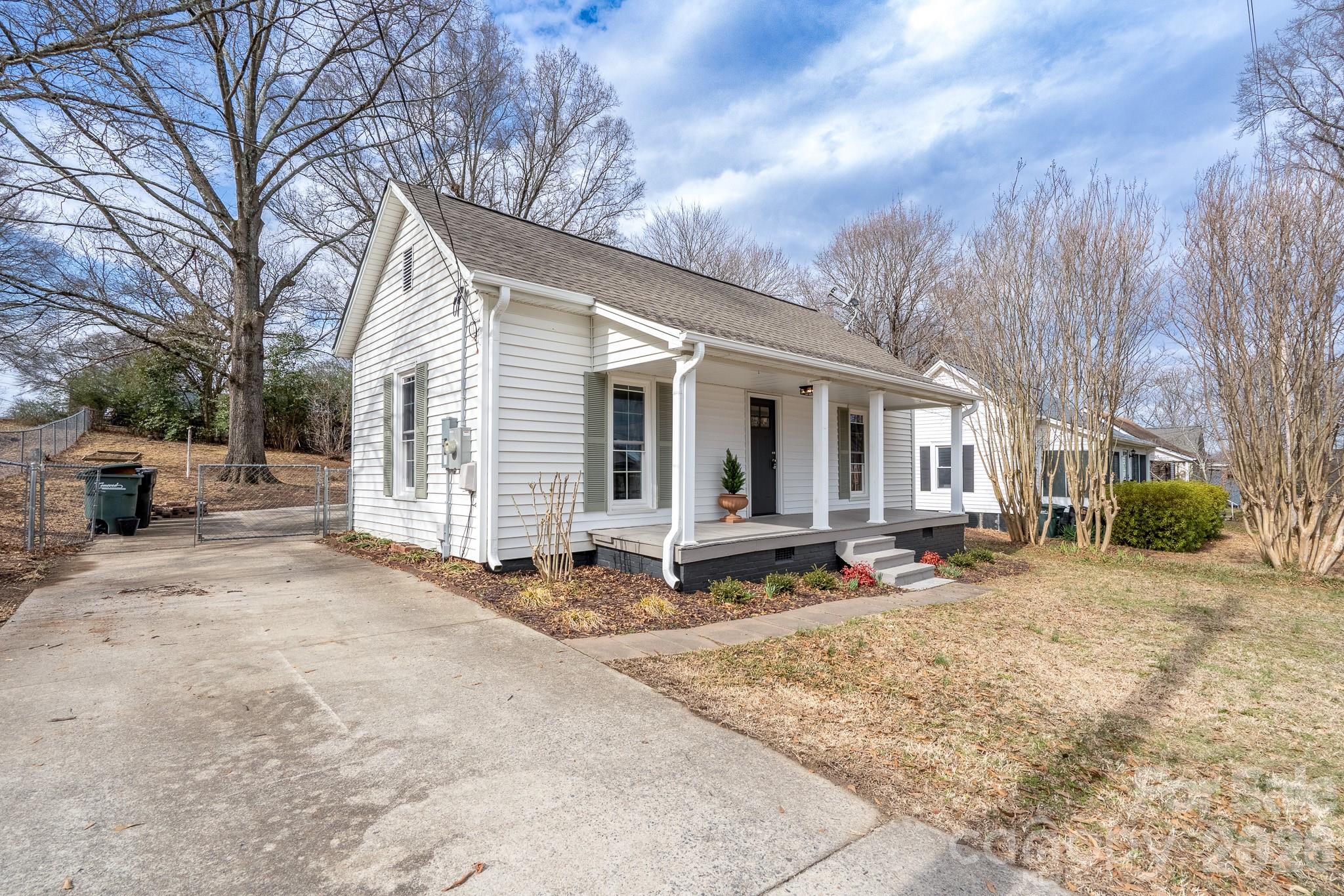 61 3rd Street Northwest Concord, NC 28027 - Photo 33 of 40 a view of a house with backyard and sitting area
