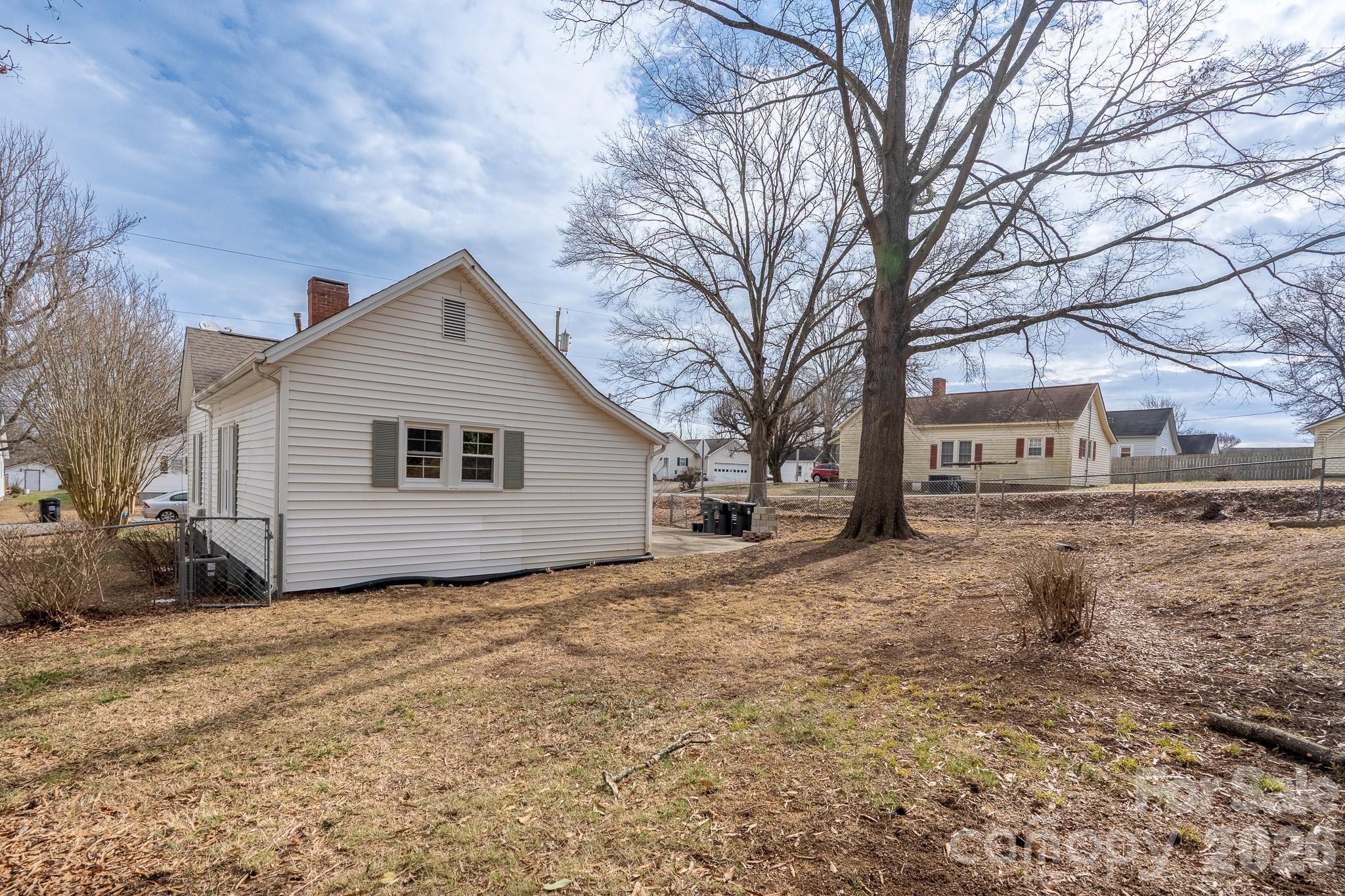61 3rd Street Northwest Concord, NC 28027 - Photo 37 of 40 a view of a house with a yard covered in snow