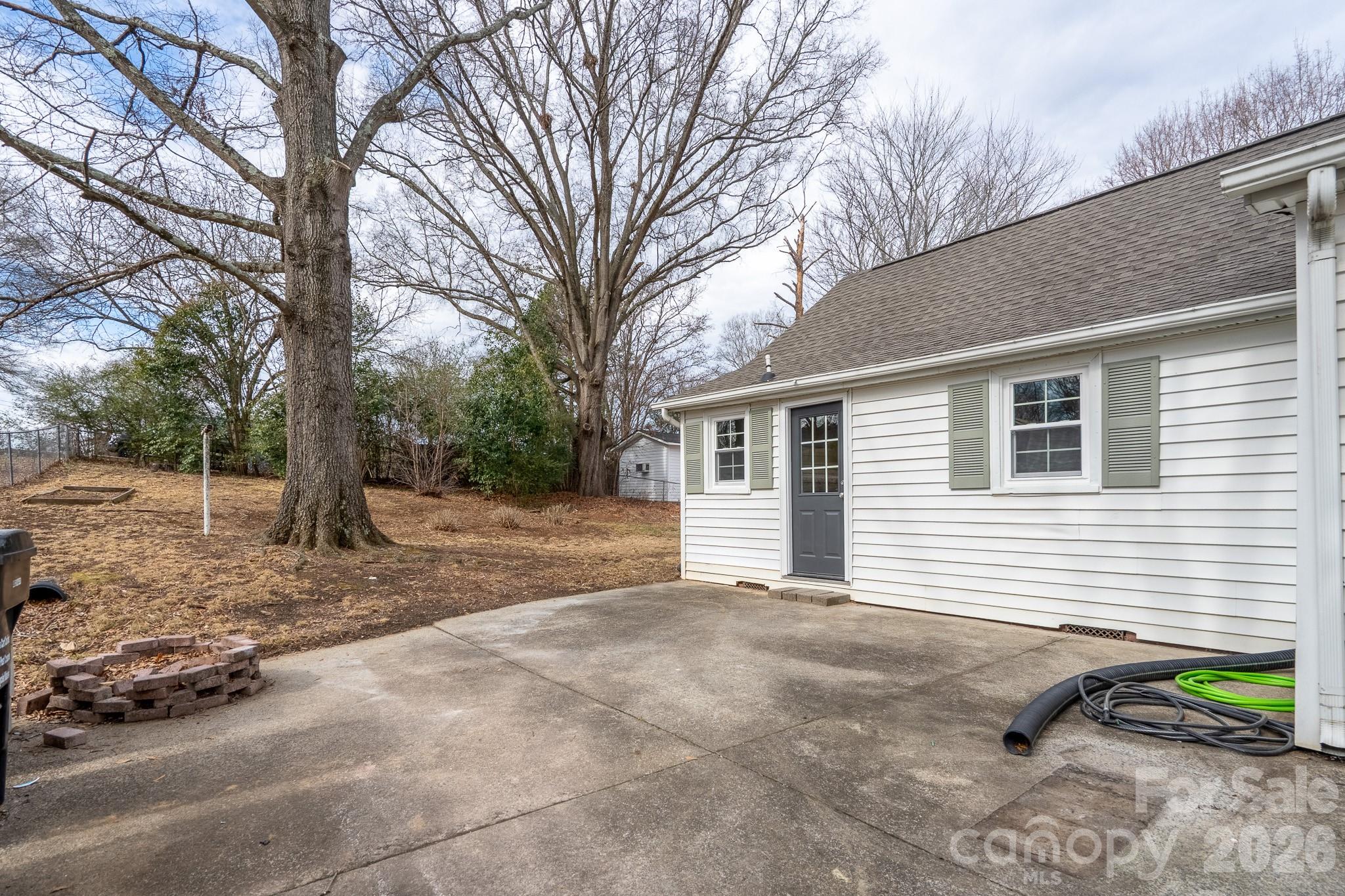 61 3rd Street Northwest Concord, NC 28027 - Photo 38 of 40 a view of a house with a yard and sitting area