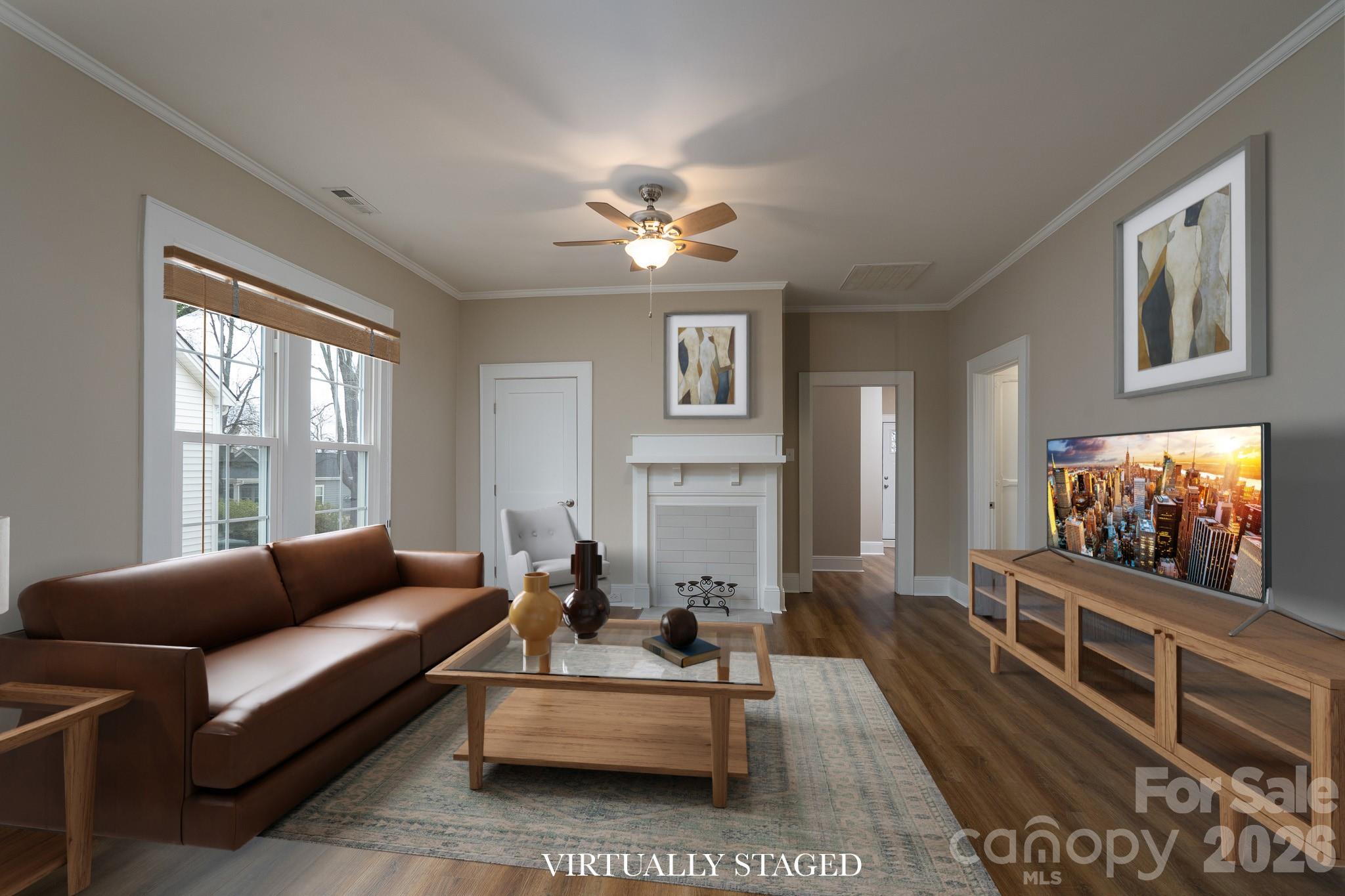 61 3rd Street Northwest Concord, NC 28027 - Photo 6 of 40 a living room with furniture a flat screen tv and a large window