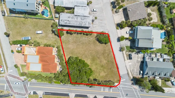 an aerial view of residential houses and outdoor space