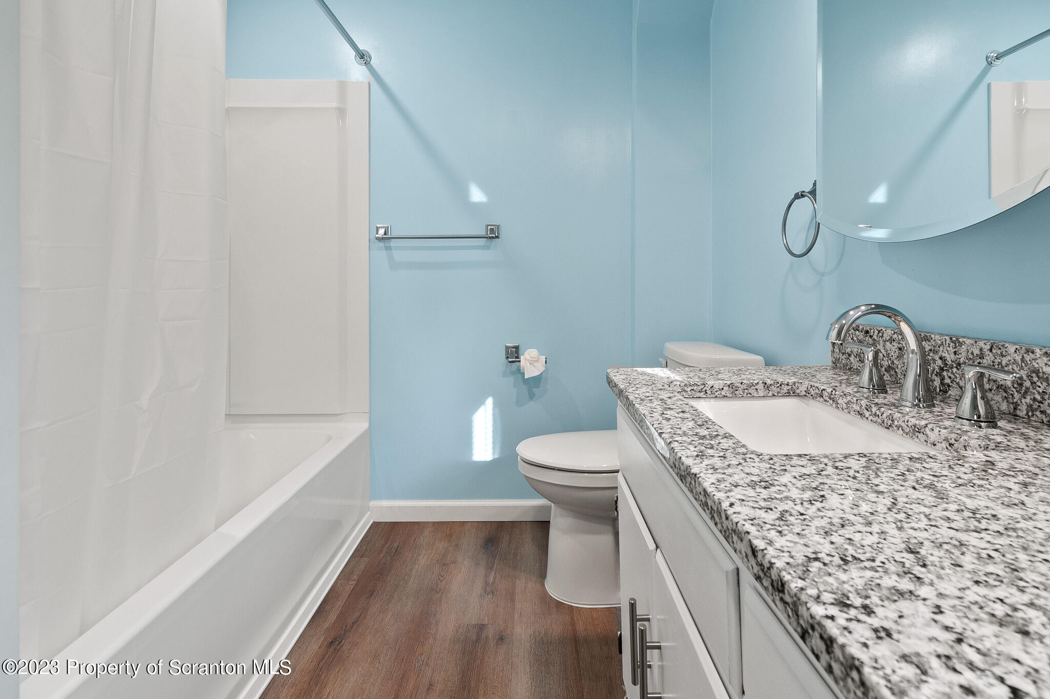1115 Fisk Street Scranton, PA 18509 - Photo 4 of 4 a bathroom with a granite countertop sink a toilet and shower