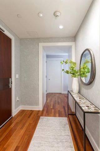 a hallway with a potted plant in front of it