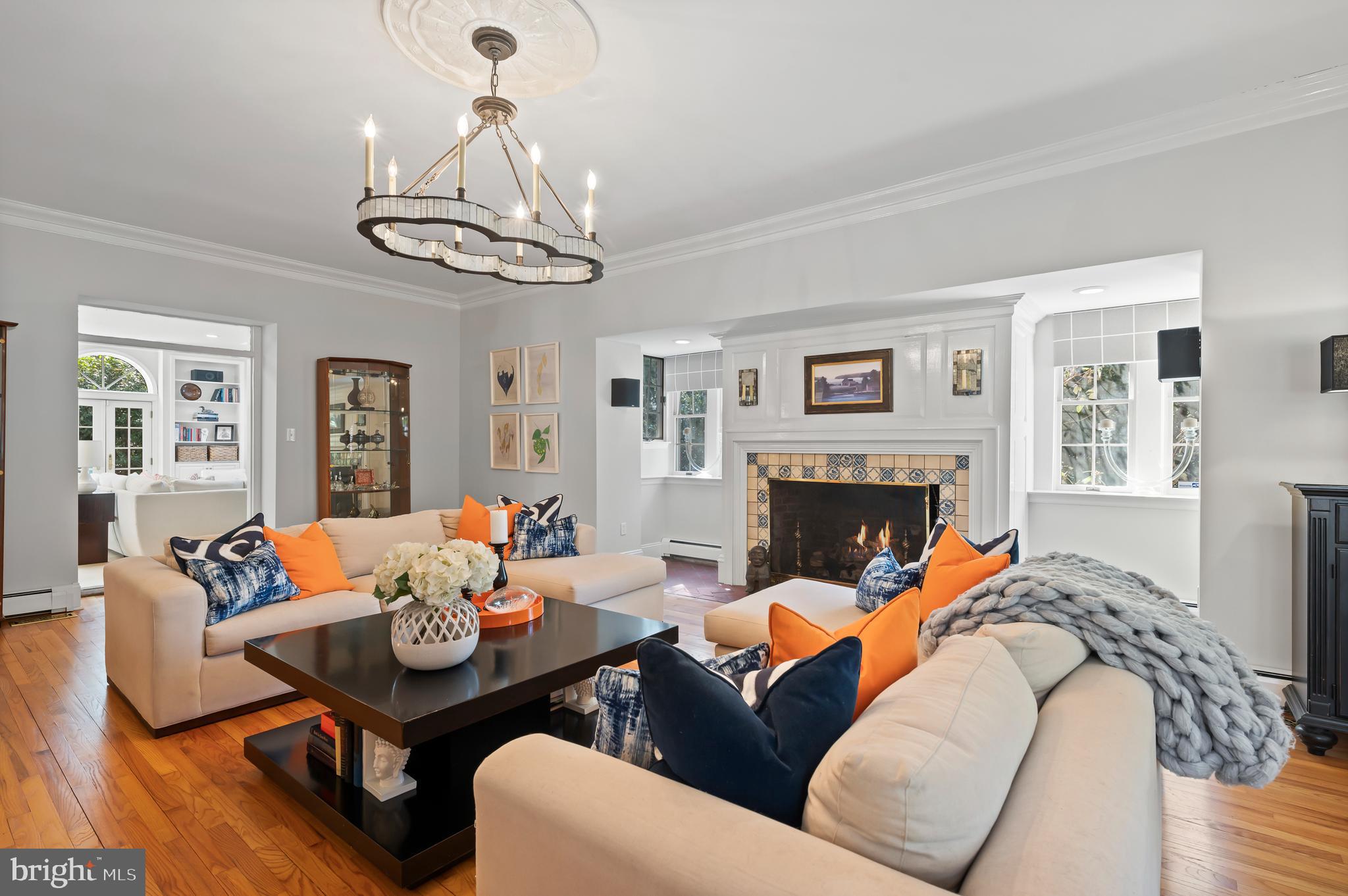 603 Foxfields Road Bryn Mawr, PA 19010 - Photo 11 of 51 a living room with furniture a fireplace and a chandelier