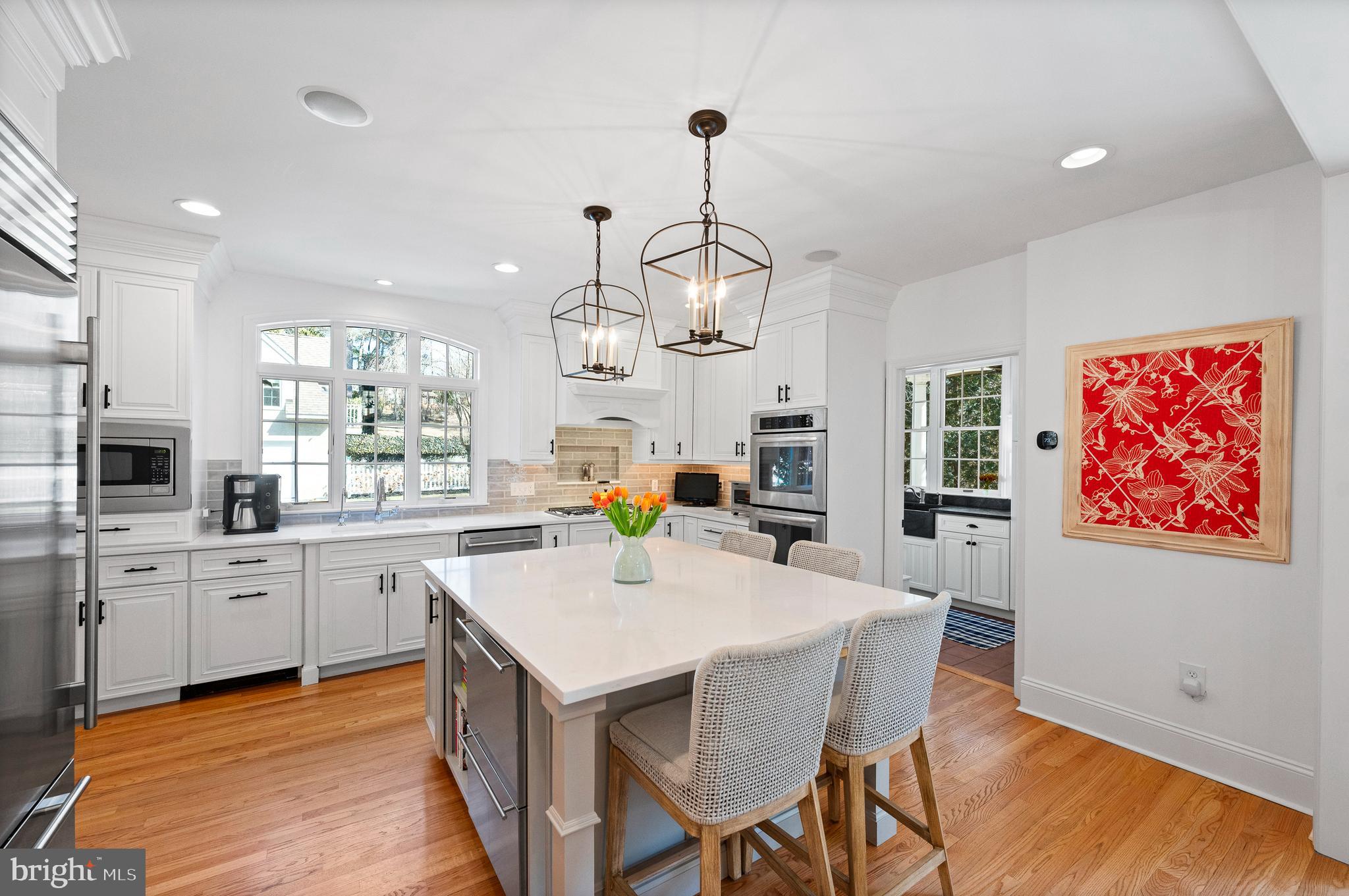 603 Foxfields Road Bryn Mawr, PA 19010 - Photo 16 of 51 a kitchen with sink cabinets and wooden floor