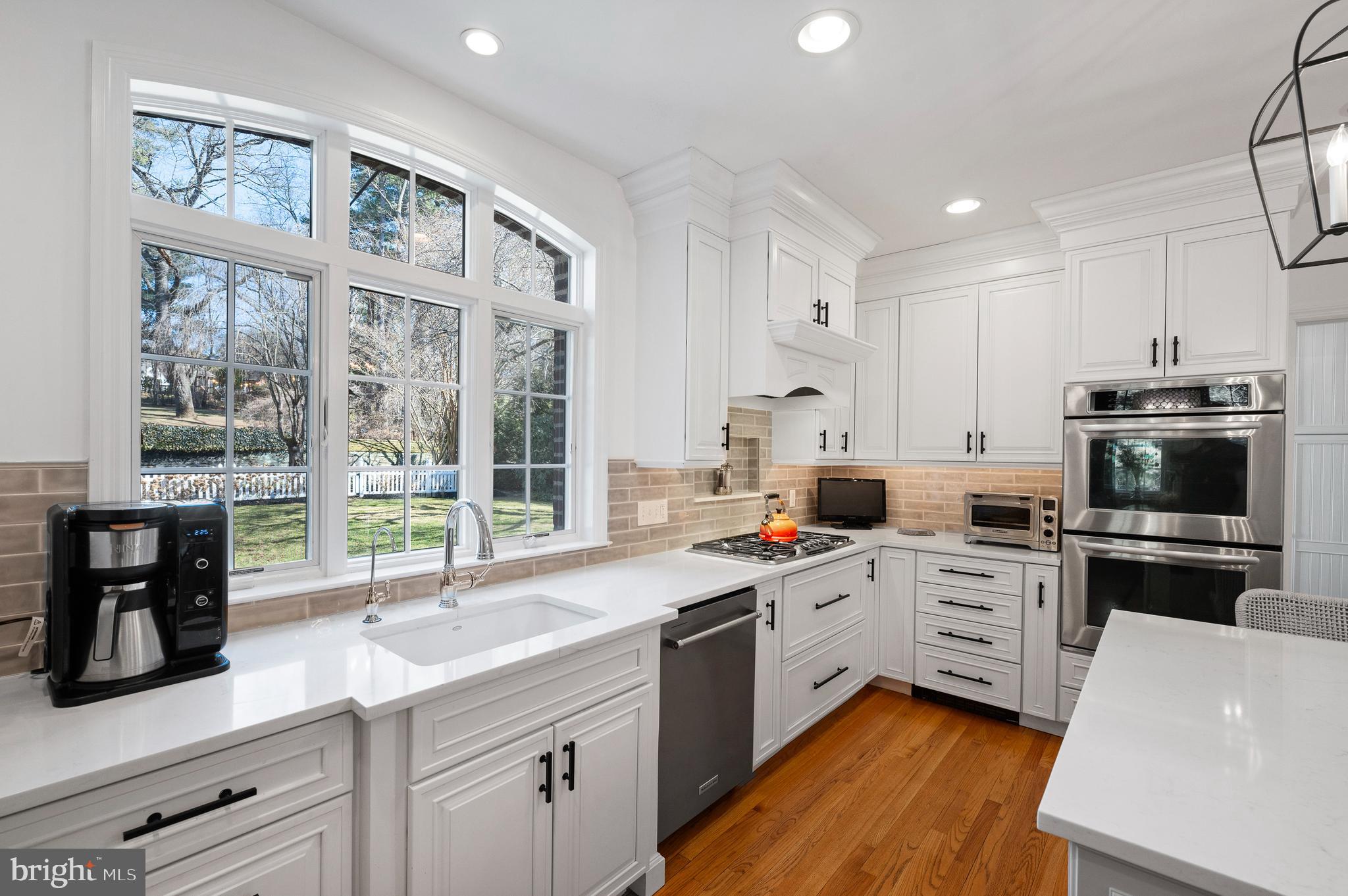 603 Foxfields Road Bryn Mawr, PA 19010 - Photo 17 of 51 a kitchen with a sink a stove and cabinets