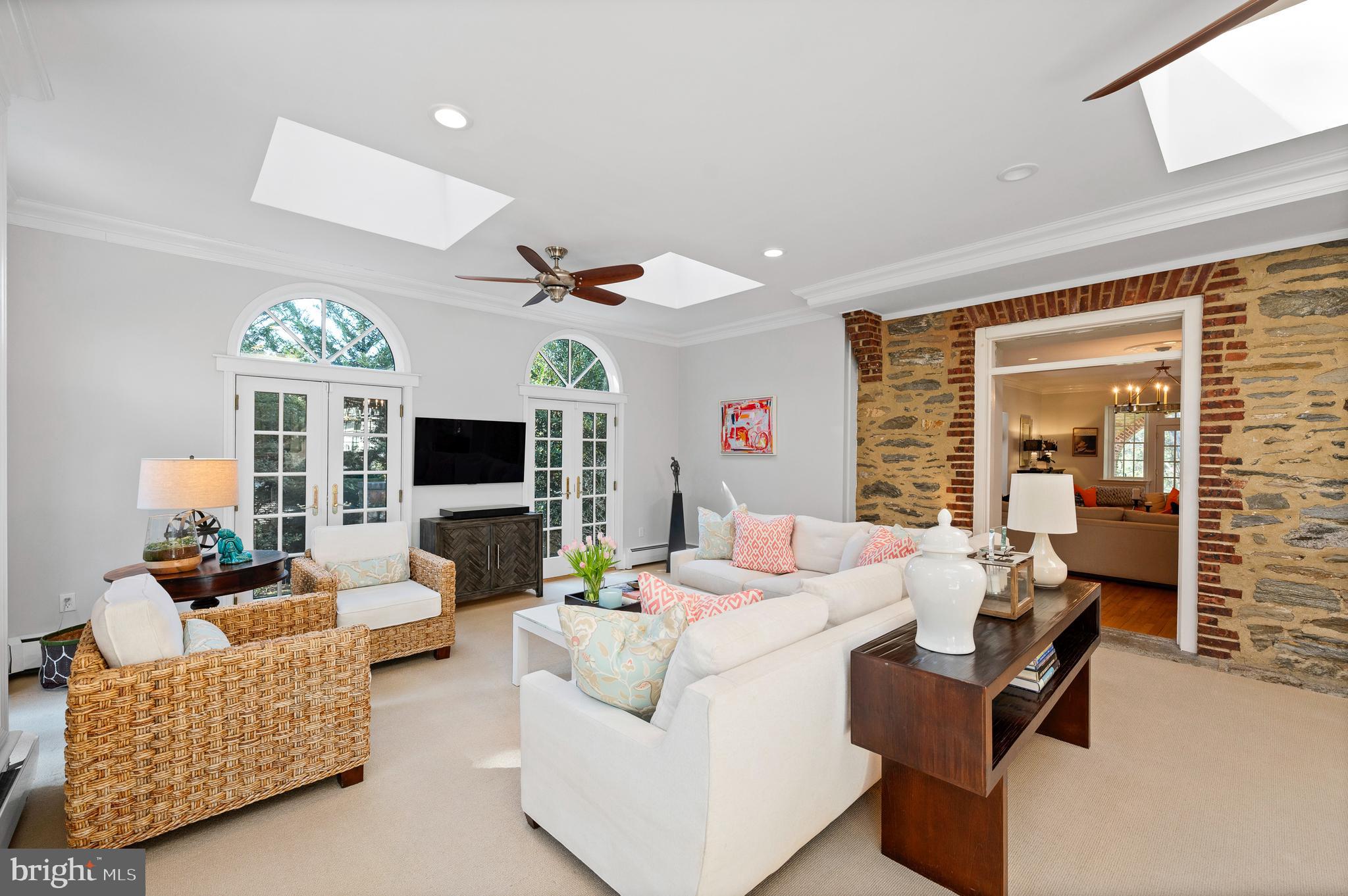 603 Foxfields Road Bryn Mawr, PA 19010 - Photo 23 of 51 a living room with furniture fireplace and a large window