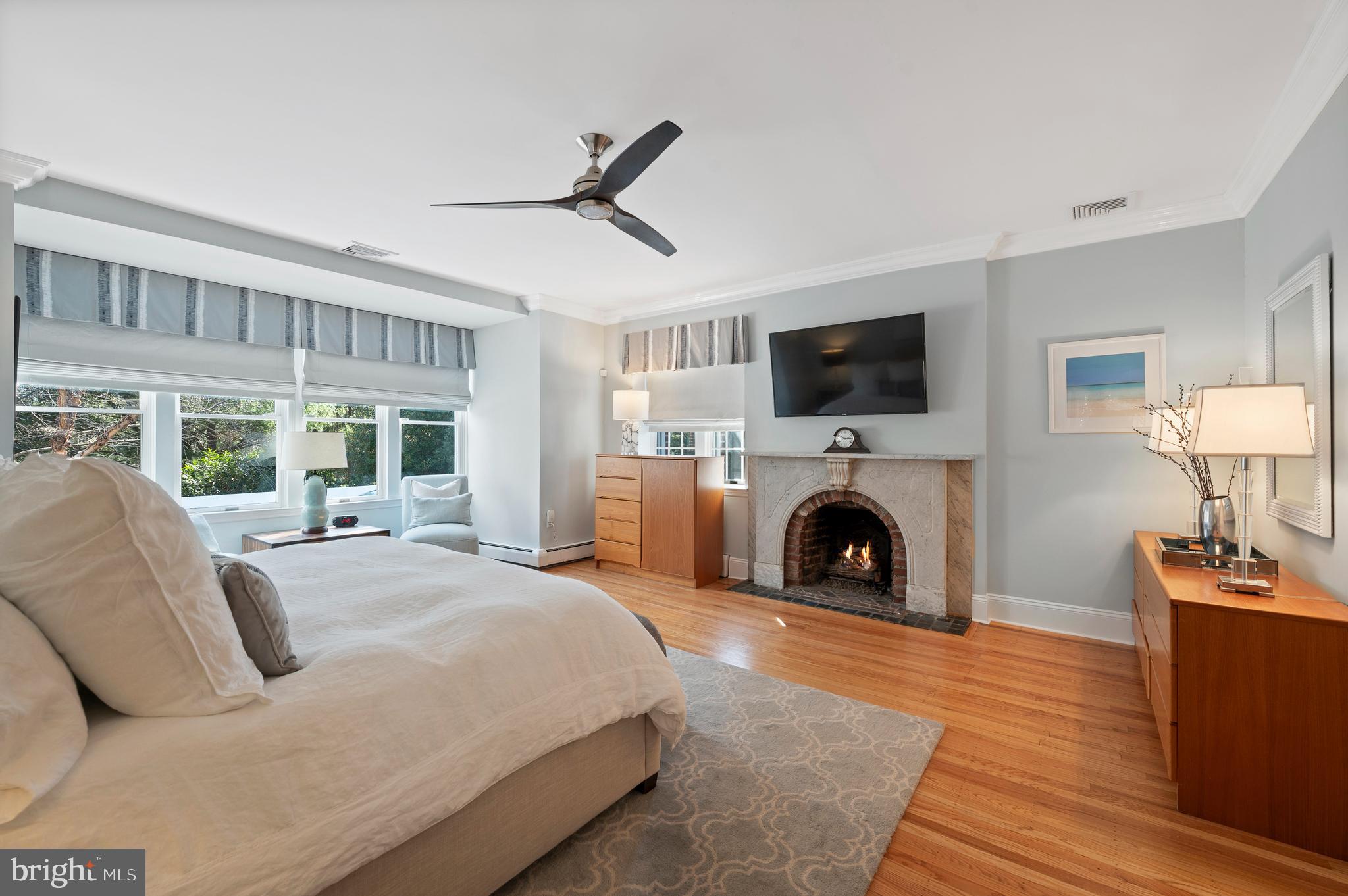 603 Foxfields Road Bryn Mawr, PA 19010 - Photo 27 of 51 a bedroom with a bed and a fireplace