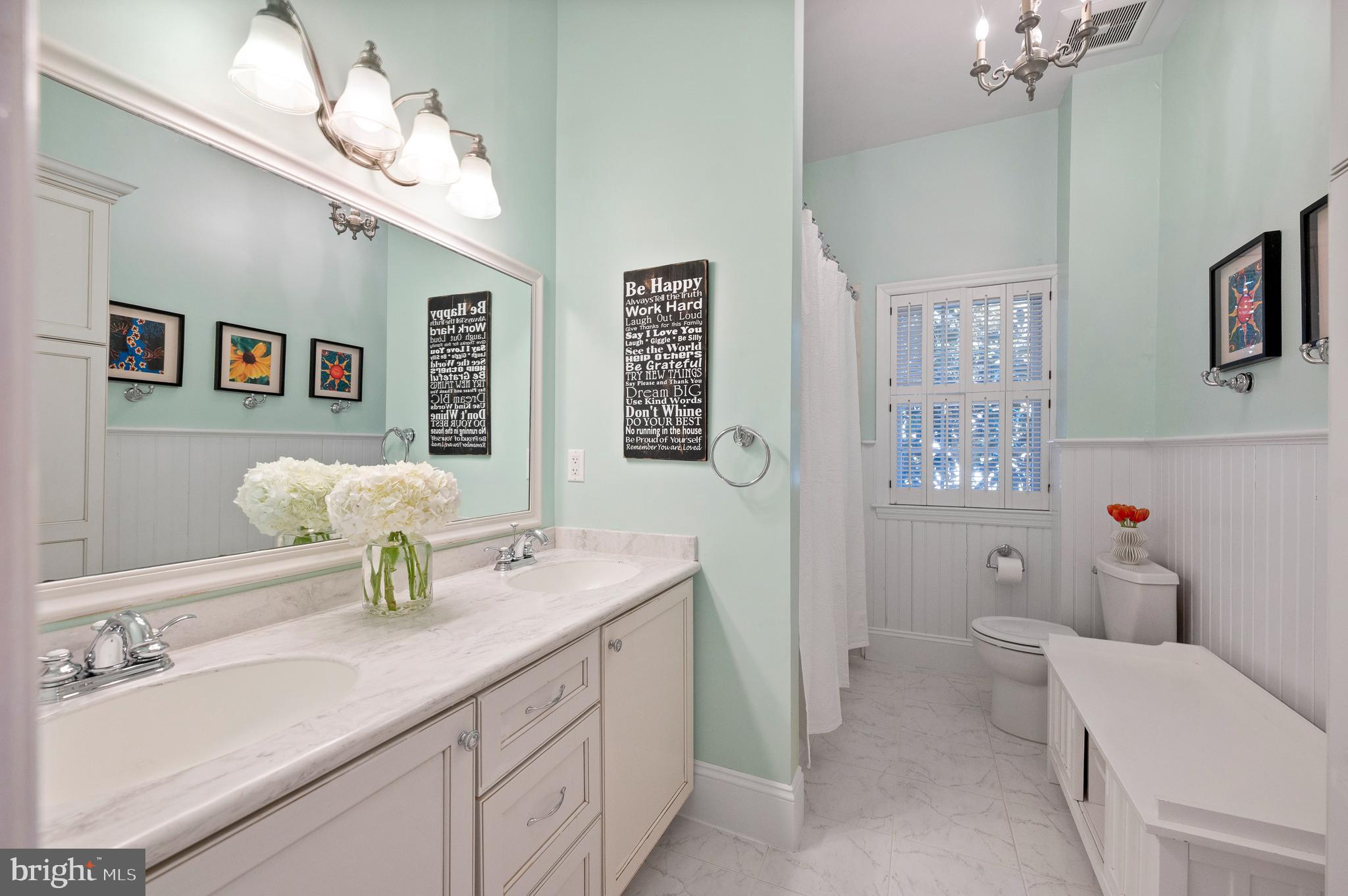 603 Foxfields Road Bryn Mawr, PA 19010 - Photo 34 of 51 a bathroom with a double vanity sink and a mirror
