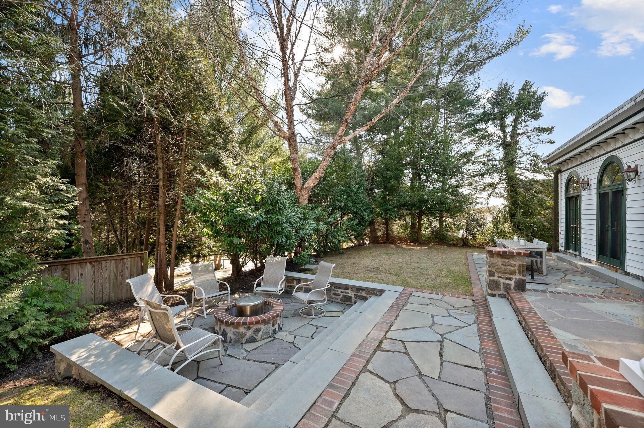 603 Foxfields Road Bryn Mawr, PA 19010 - Photo 47 of 51 a view of a patio with table and chairs and potted plants