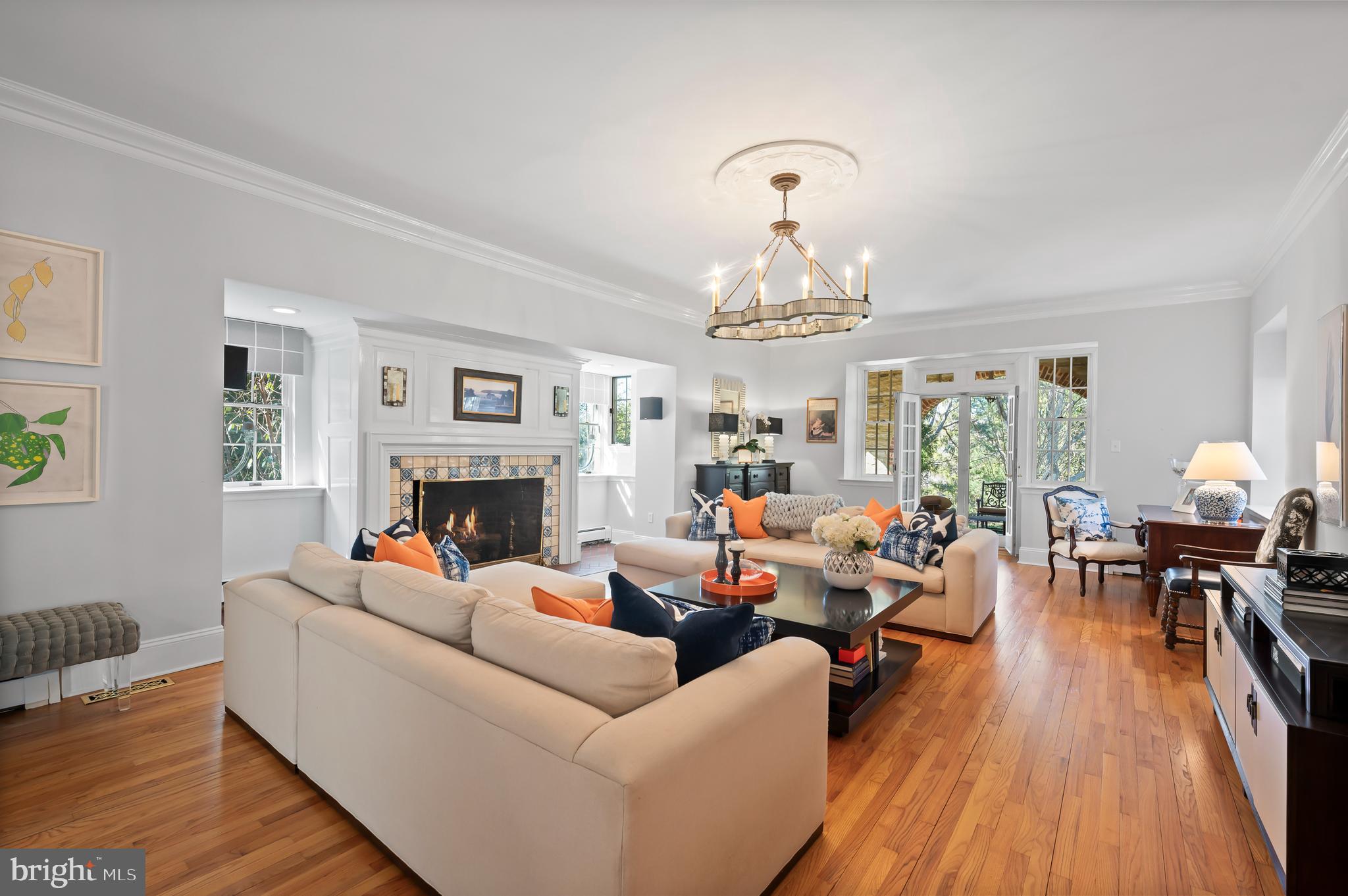 603 Foxfields Road Bryn Mawr, PA 19010 - Photo 10 of 51 a living room with fireplace furniture and a chandelier
