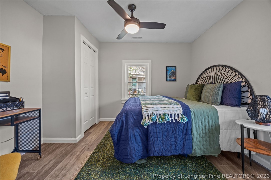 625 Eva Circle Spring Lake, NC 28390 - Photo 4 of 28 a bedroom with a bed and a chandelier