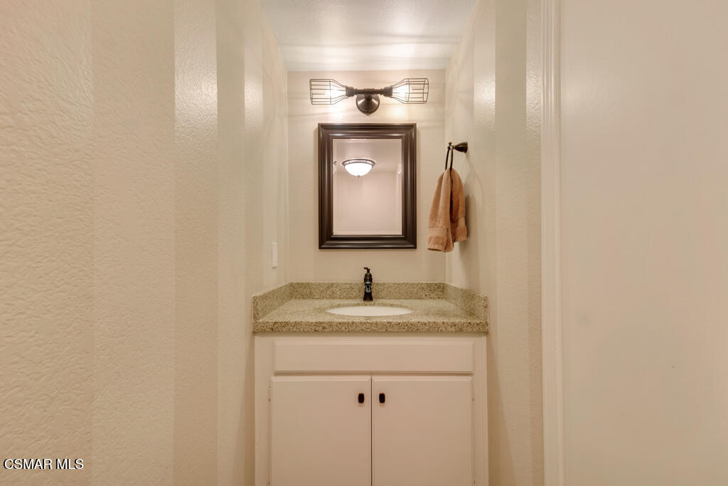 1980 Rory Lane, Unit 3 Simi Valley, CA 93063 - Photo 11 of 33 a bathroom with a sink and a mirror