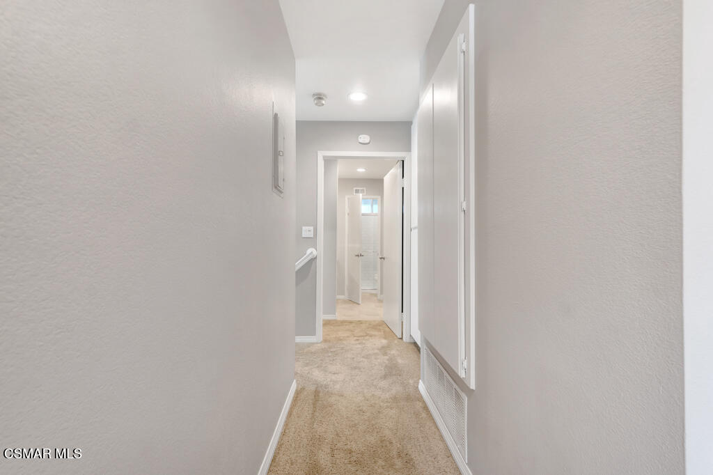 1980 Rory Lane, Unit 3 Simi Valley, CA 93063 - Photo 20 of 33 a view of a hallway with a white walls