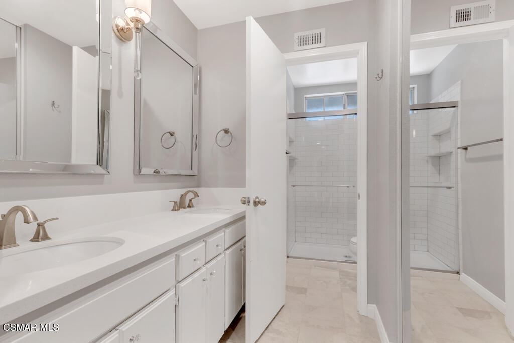 1980 Rory Lane, Unit 3 Simi Valley, CA 93063 - Photo 23 of 33 a bathroom with a sink and a mirror