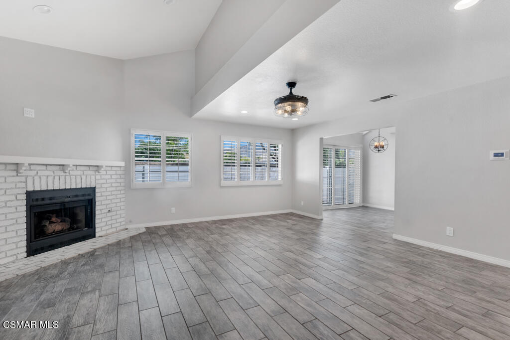 1980 Rory Lane, Unit 3 Simi Valley, CA 93063 - Photo 4 of 33 an empty room with windows and fireplace