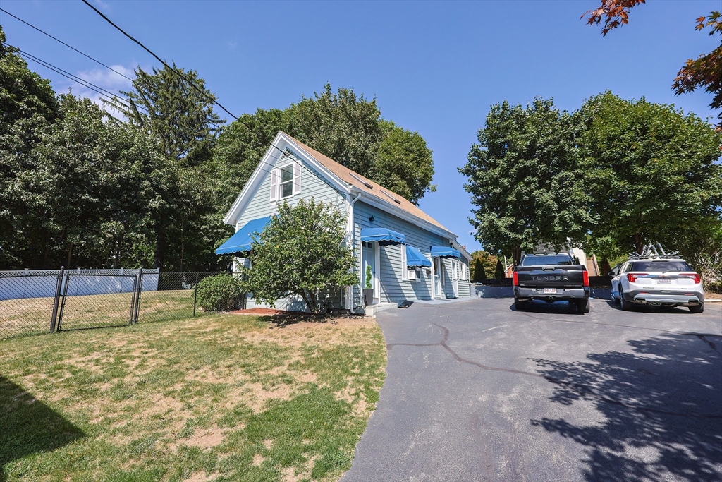 64 Smith Street North Attleboro, MA 02760 - Photo 2 of 42 a car parked in front of a house