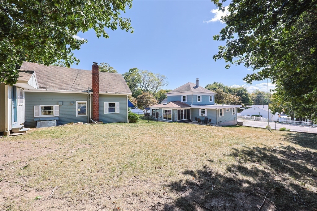 64 Smith Street North Attleboro, MA 02760 - Photo 26 of 42 a front view of a house with a yard and garage