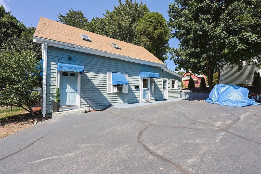 64 Smith Street North Attleboro, MA 02760 - Photo 27 of 42 a front view of a house with a patio